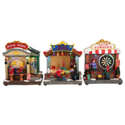 Carillon Villaggio Di Natale Animato Con Bancarelle Dei Giochi Di Natale E Luci LED 14x9,5x16,5cm Assortiti