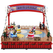 Carillon Villaggio Di Natale Animato Con Parco Giochi E Tazzine Girevoli E Luci A LED 29x28x22,5cm