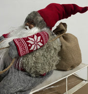Statuina di Babbo Natale Seduto Sulla Slitta
